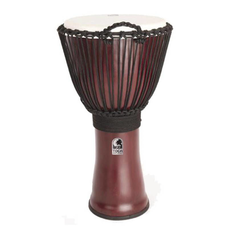 Red Toca Freestyle 2 Series 12-inch rope-tuned djembe with traditional carved wood design and drumhead for percussion playing.