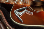 Jim Dunlop Trigger Fly Capo in satin chrome, a guitar capo with a sleek, compact design for easy one-handed operation.