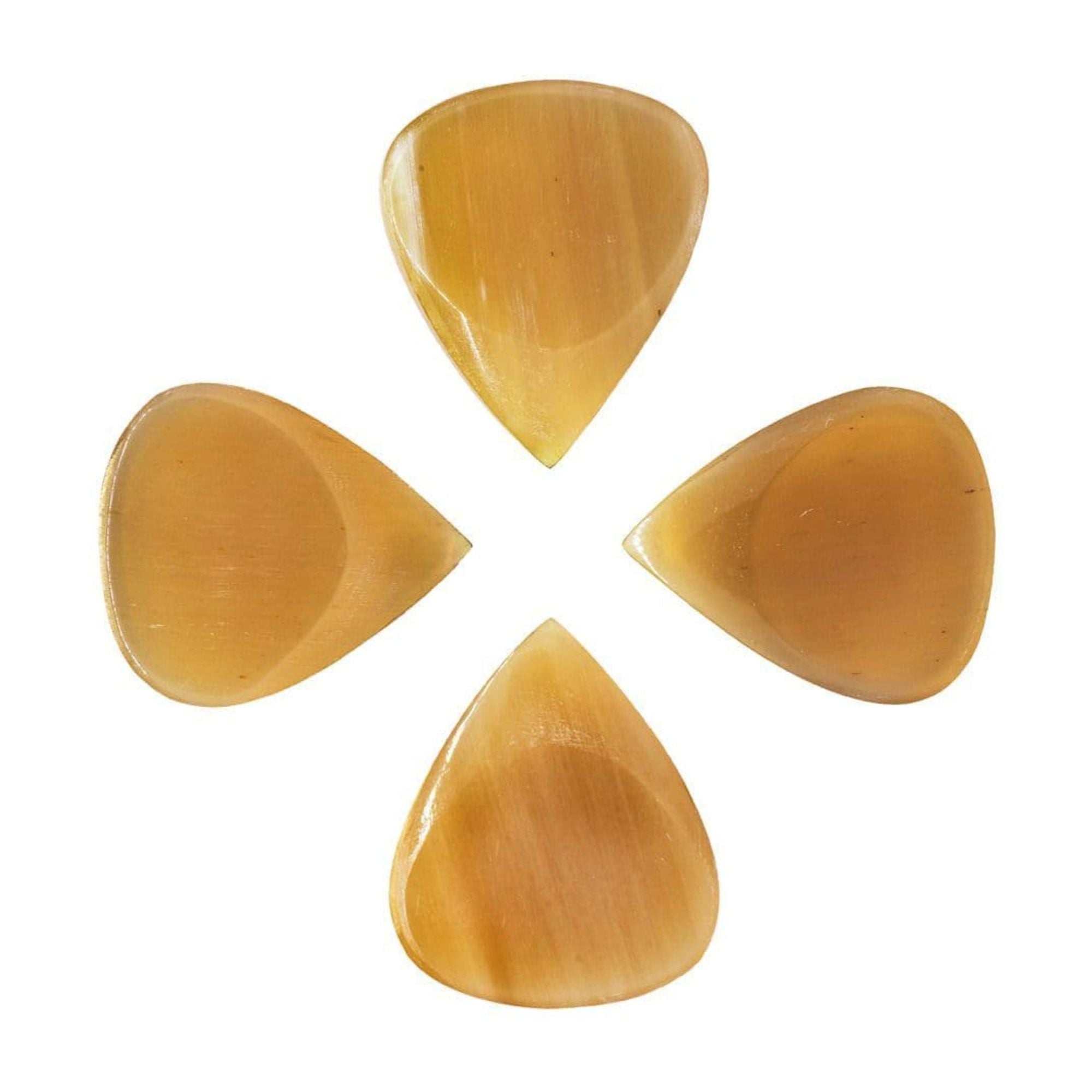 Set of four Timbertone Jazz Tones Fat Clear Horn guitar picks with a smooth, translucent finish for versatile playing.
