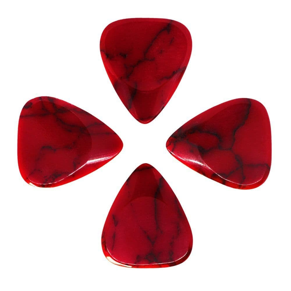 Four Timber Tones Stone Tones Bloody Basin Jasper guitar picks arranged in a row on a neutral background.