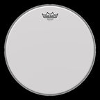 Remo Ambassador Vintage coated 14-inch drumhead, showcasing the textured surface and branding on a drum head.