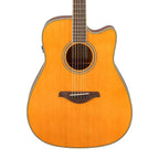 Yamaha FGC-TA traditional Western-style cutaway acoustic guitar with vintage tint finish, showing the body and fretboard details.