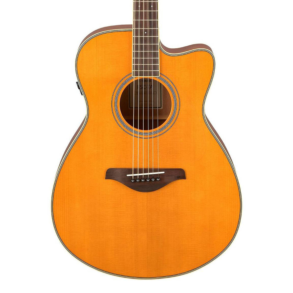Yamaha FSC-TA concert style cutaway acoustic guitar in vintage tint with rosewood fingerboard and natural finish.