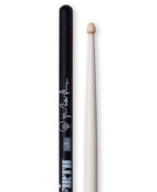 Vic Firth Questlove Signature drumsticks resting on a drum kit, showcasing the signature design and professional-grade wood construction.