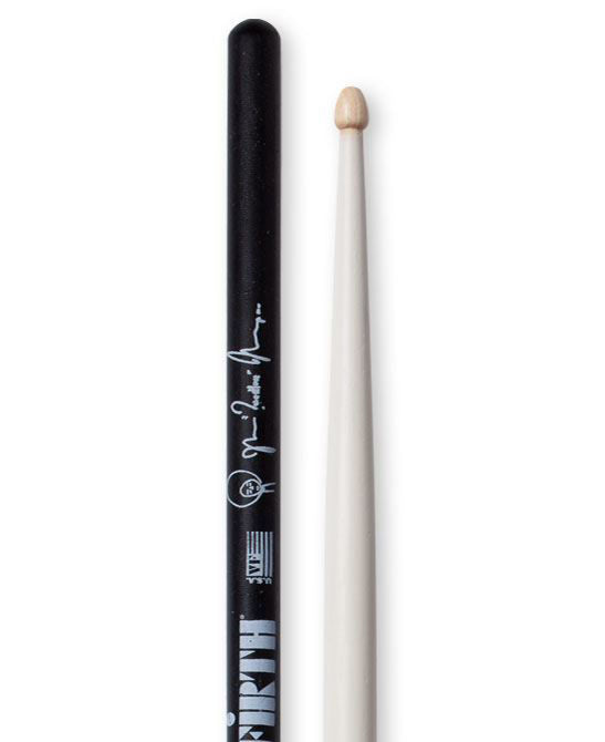 Vic Firth Questlove Signature drumsticks resting on a drum kit, showcasing the signature design and professional-grade wood construction.