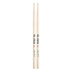 Vic Firth Signature Series Steve Gadd clear finish wood tip drumsticks lying on a drum kit with drum heads and cymbals.