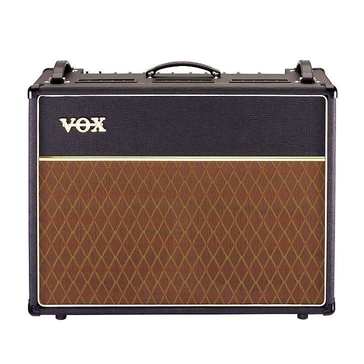 Vox AC30C2X Custom Twin Combo Guitar Amplifier with two speakers, control knobs, and Vox branding on the front panel.