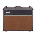 Vox AC30C2X Custom Twin Combo Guitar Amplifier with two speakers, control knobs, and Vox branding on the front panel.