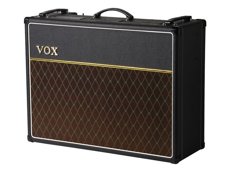 Vox AC30C2X Custom Twin Combo Guitar Amplifier with silver grille cloth and control panel on top, ideal for electric guitar sound.