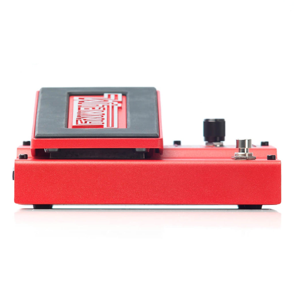 Digitech Whammy effects pedal showing its colorful control knob and footswitch on a black pedalboard.
