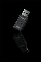 Roland WM-1D Wireless MIDI Dongle with USB connection for seamless data transfer and connectivity.