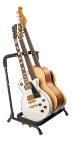 XTR Xtr Multi 3 Guitar Stand holding three electric guitars with padded support and adjustable arms for secure display.