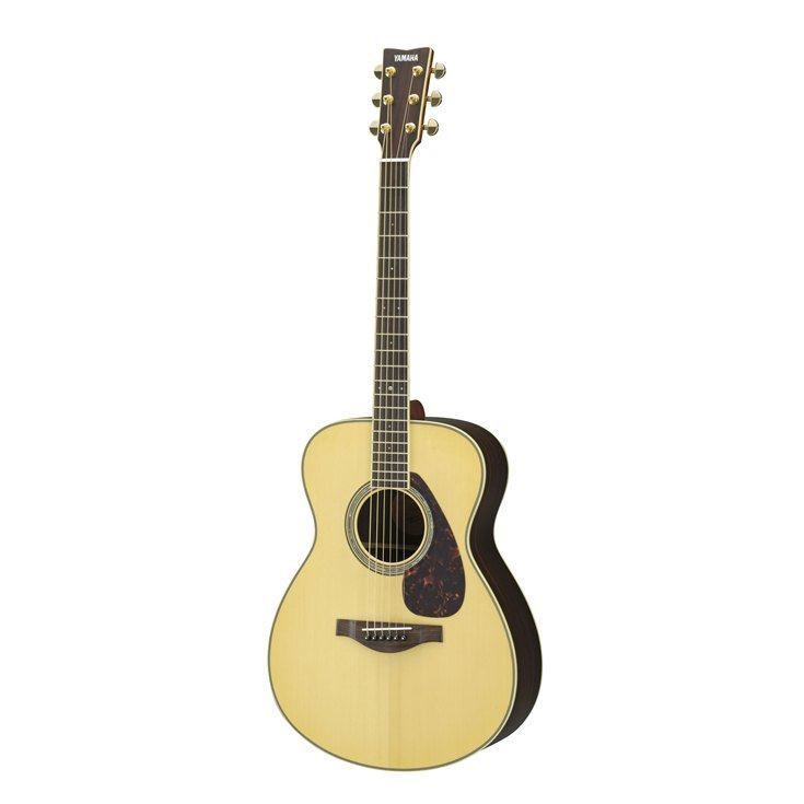 Yamaha LS6 small body acoustic guitar with natural finish, rosewood back and sides, showcasing its compact shape and wood grain details.