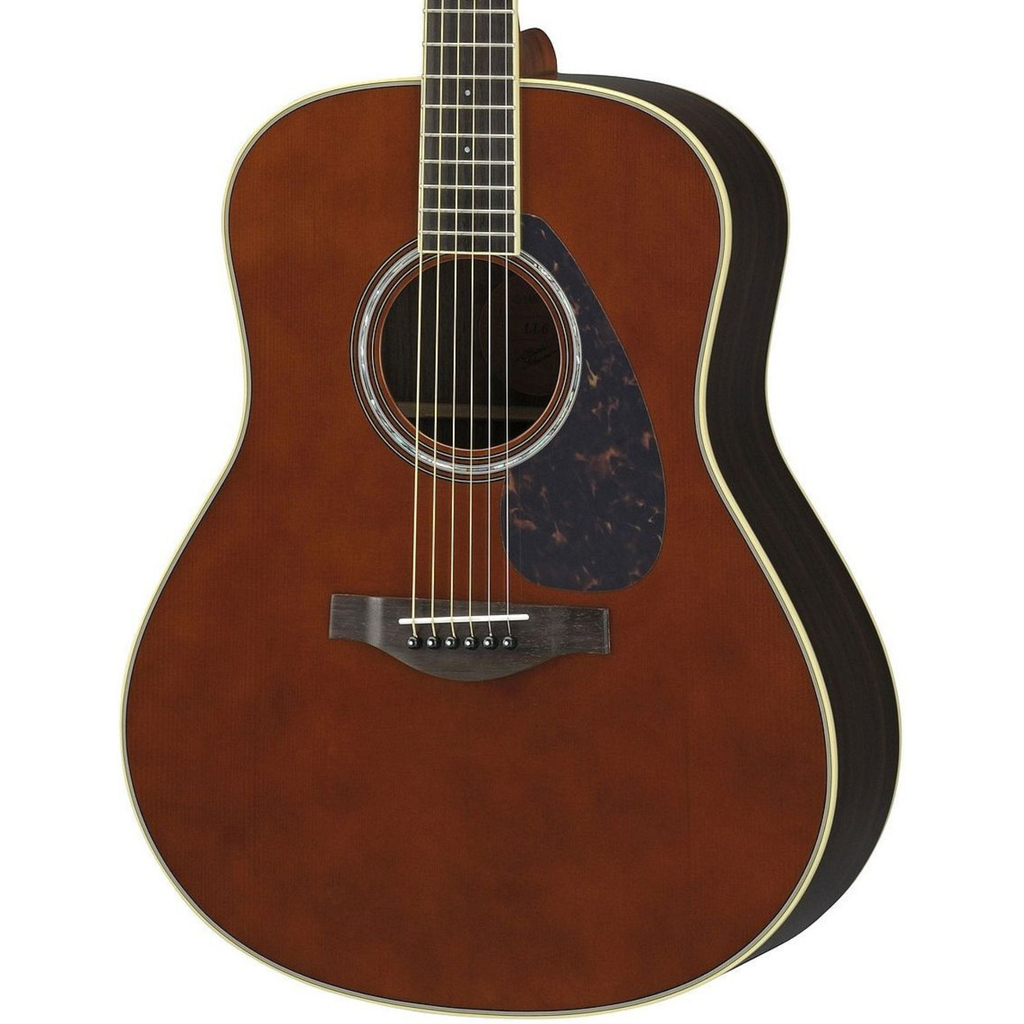 Yamaha LL6-DT//ARE acoustic guitar with dark tinted finish, showcasing its body, soundhole, and strings in a natural setting.
