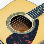 Yamaha LL16M-NT/ARE acoustic guitar in natural finish, featuring a solid wood top and cutaway body design.