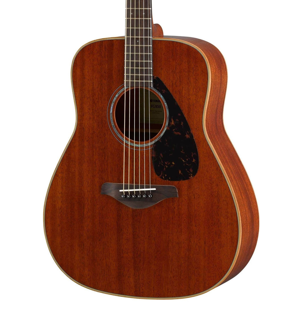 Yamaha FG850 dreadnought acoustic guitar with solid spruce top in natural finish, showing the body and fretboard details.