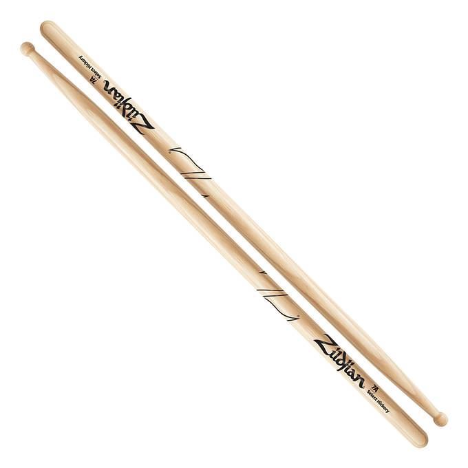 Zildjian Hickory 7A drumsticks lying on a drum kit, showcasing their lightweight design and natural wood finish.