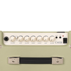 Cort CM15R PG 15W guitar combo amplifier in pastel green with control knobs and speaker grille, designed for electric guitar sound.