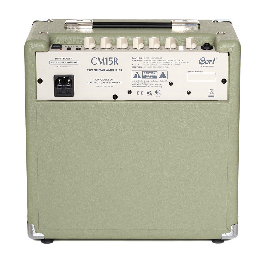 Cort CM15R PG 15W guitar combo amplifier in pastel green, featuring a compact design and control knobs for electric guitar.