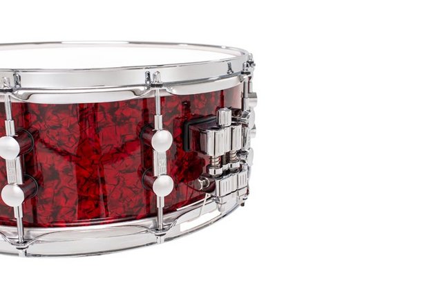 Sonor Momentum Birch 14x5.75-inch red pearl snare drum with polished hardware and detailed drum shell.