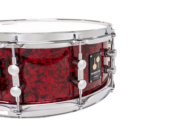 SONOR Momentum Birch 14x5.75-inch red pearl snare drum with chrome hardware and textured finish.