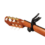 D'Addario Planet Waves PW-CP-13 Artist Classical Guitar Capo in black, shown on an acoustic guitar neck with a transparent background