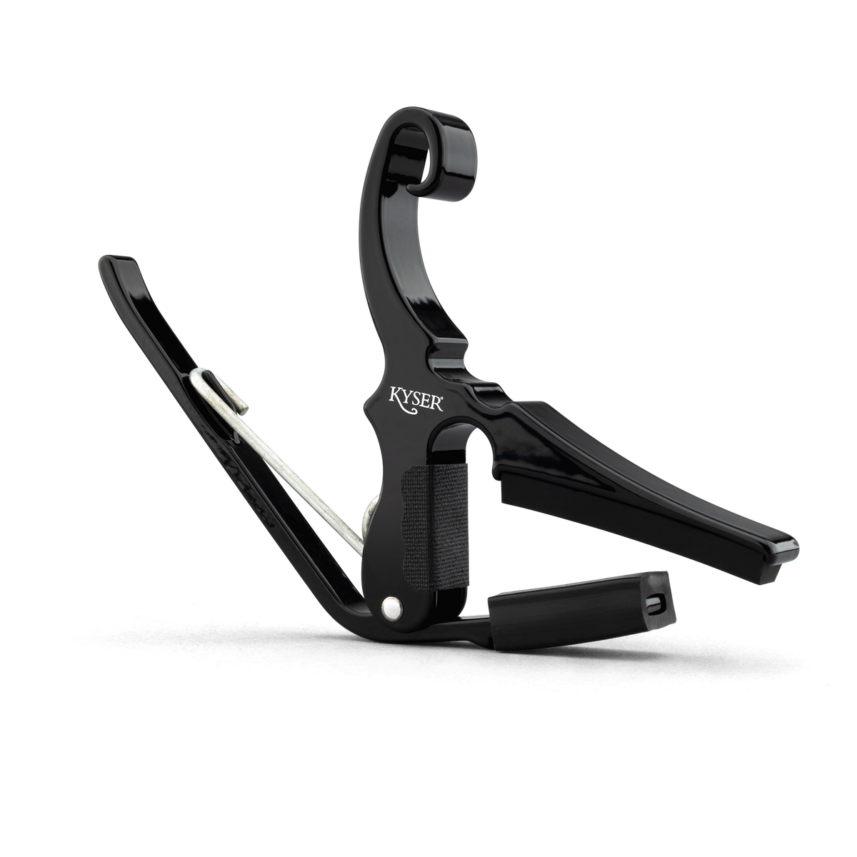 Black Kyser KGDBA Drop D guitar capo attached to a guitar neck, showcasing a compact and easy-to-use design for tuning adjustments.
